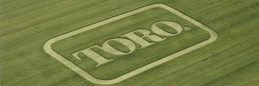 Bird's eye view of Toro logo mowed into the grass