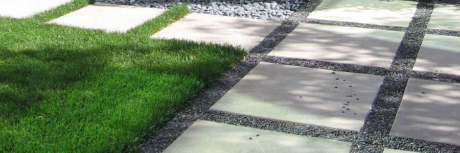 Lawn and aggregate walkway separated by Permaloc landscape edging